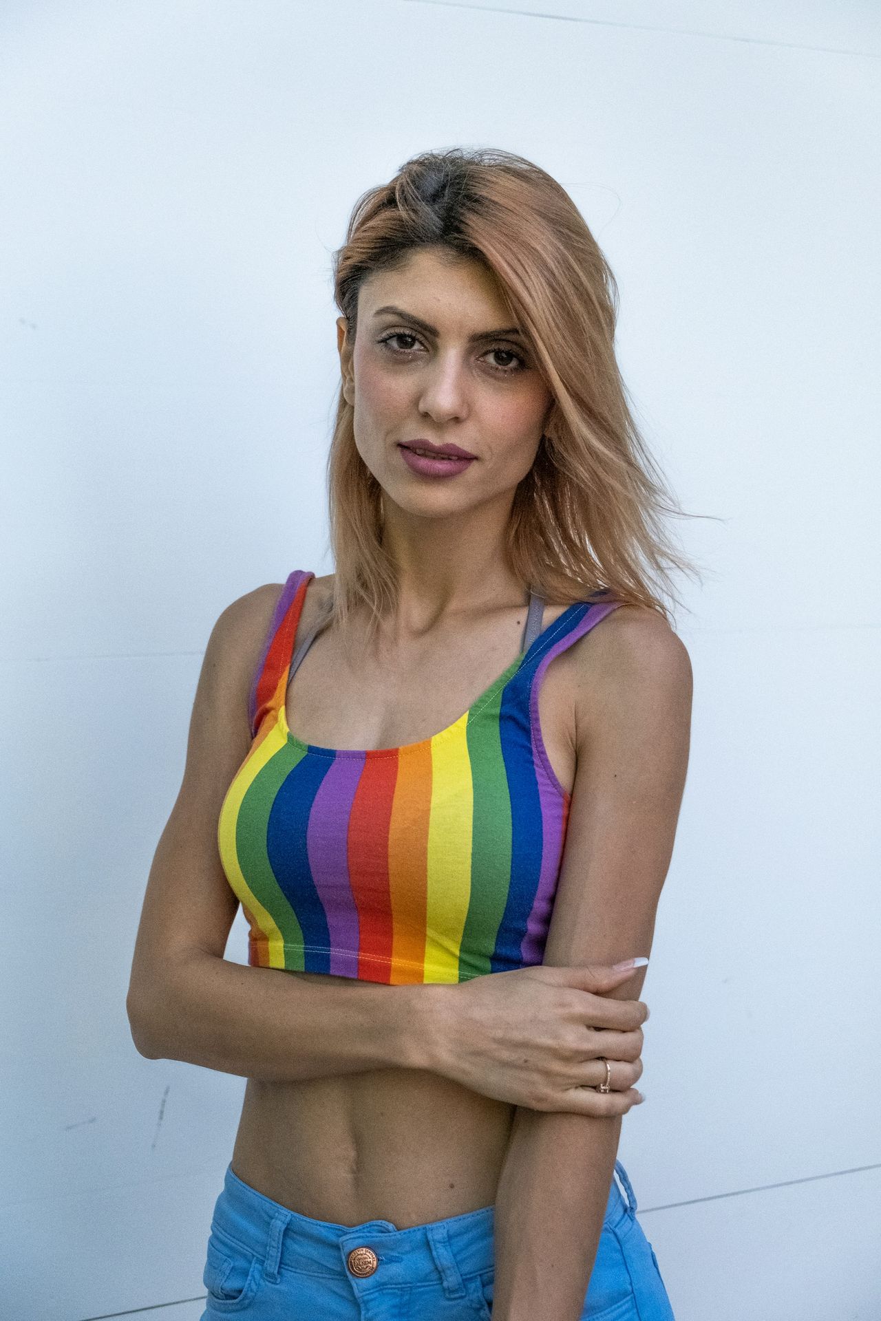 woman in pink and yellow tank top